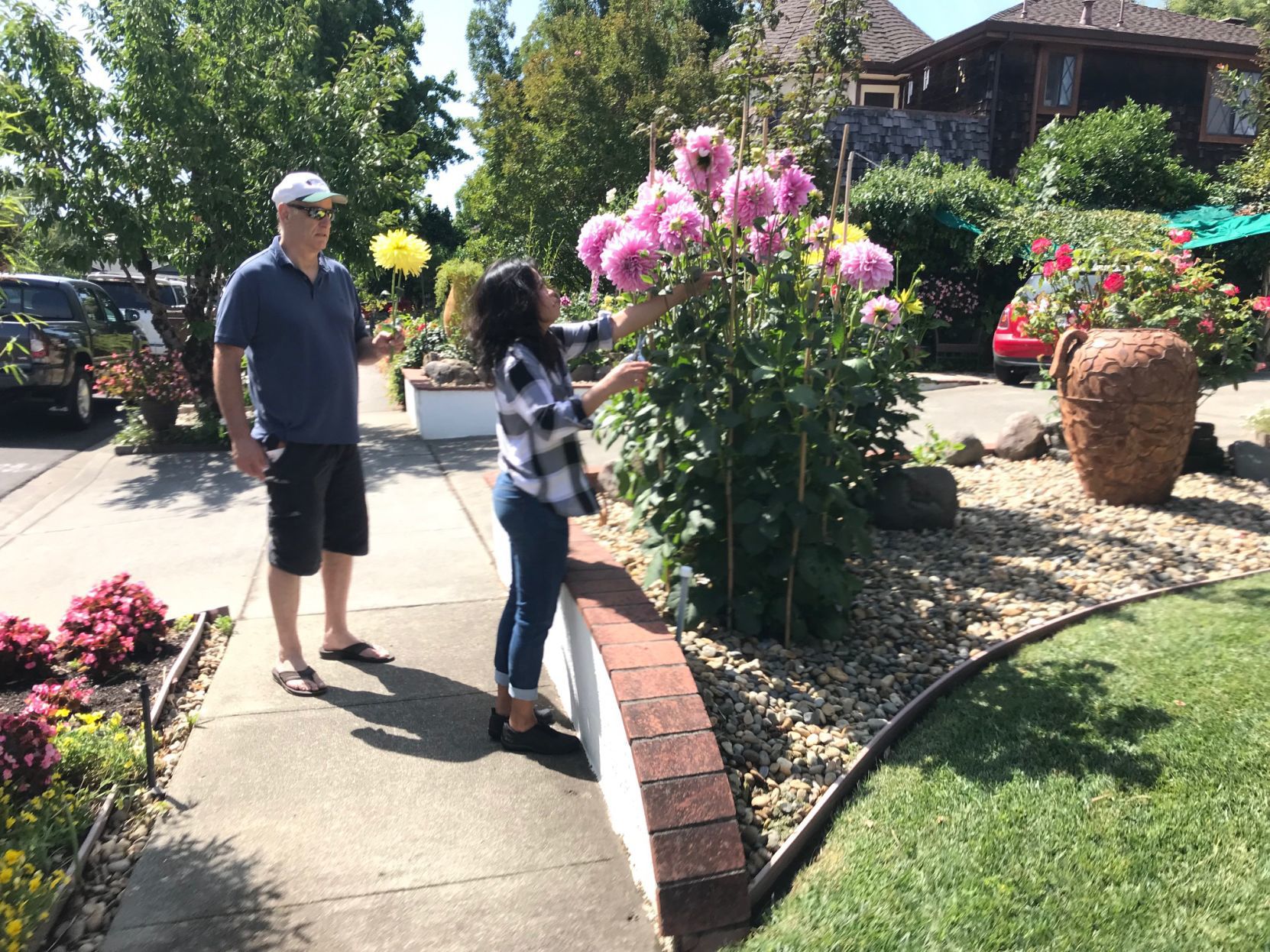 Marcell and Brian Gallagher tend to their flowers at their north Napa home.